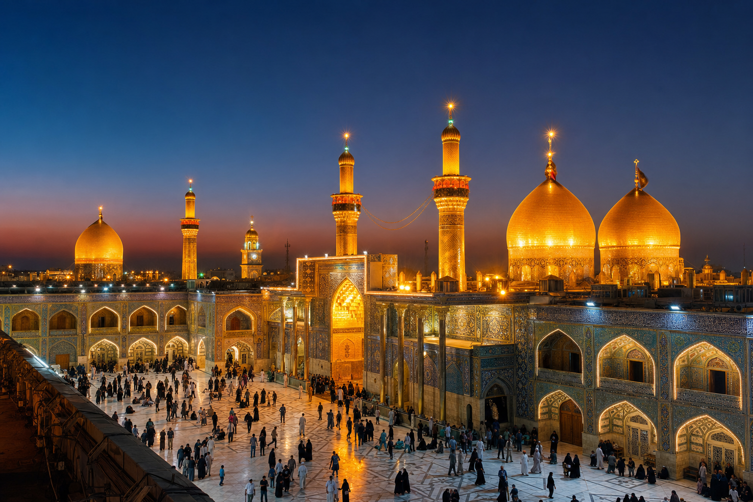 Golden domes of Karbala glowing at dusk